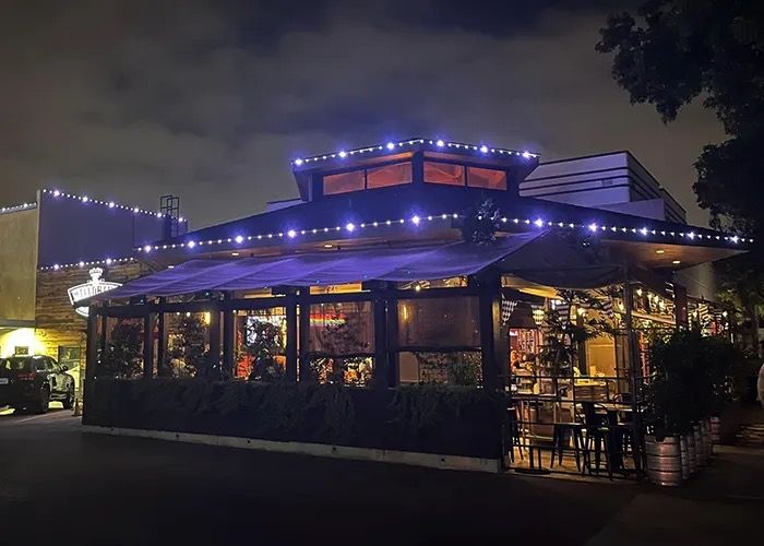Restaurant with lights tracing the roof and awning