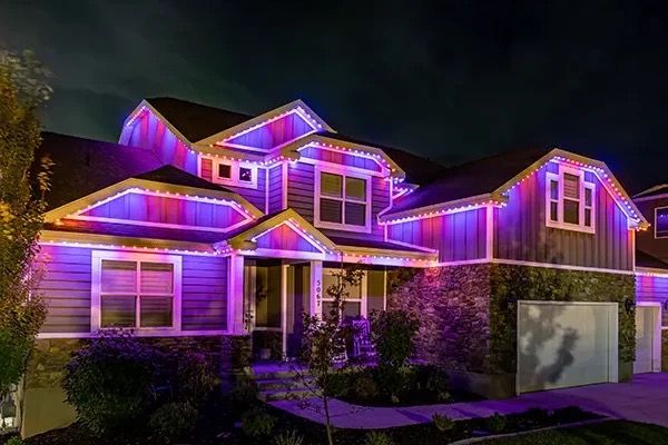 House with violet and blue lights on the peaks
